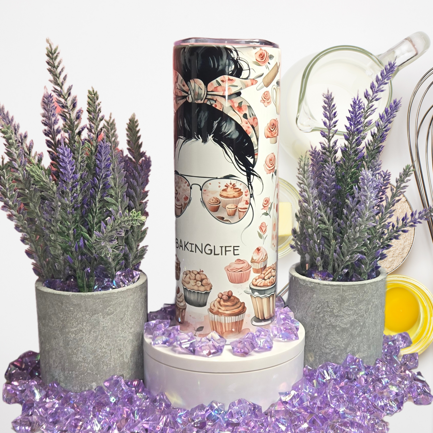 BakingLife 20 oz Stainless Steel Tumbler with messy bun design and cupcake sunglasses, surrounded by lavender and baking tools.