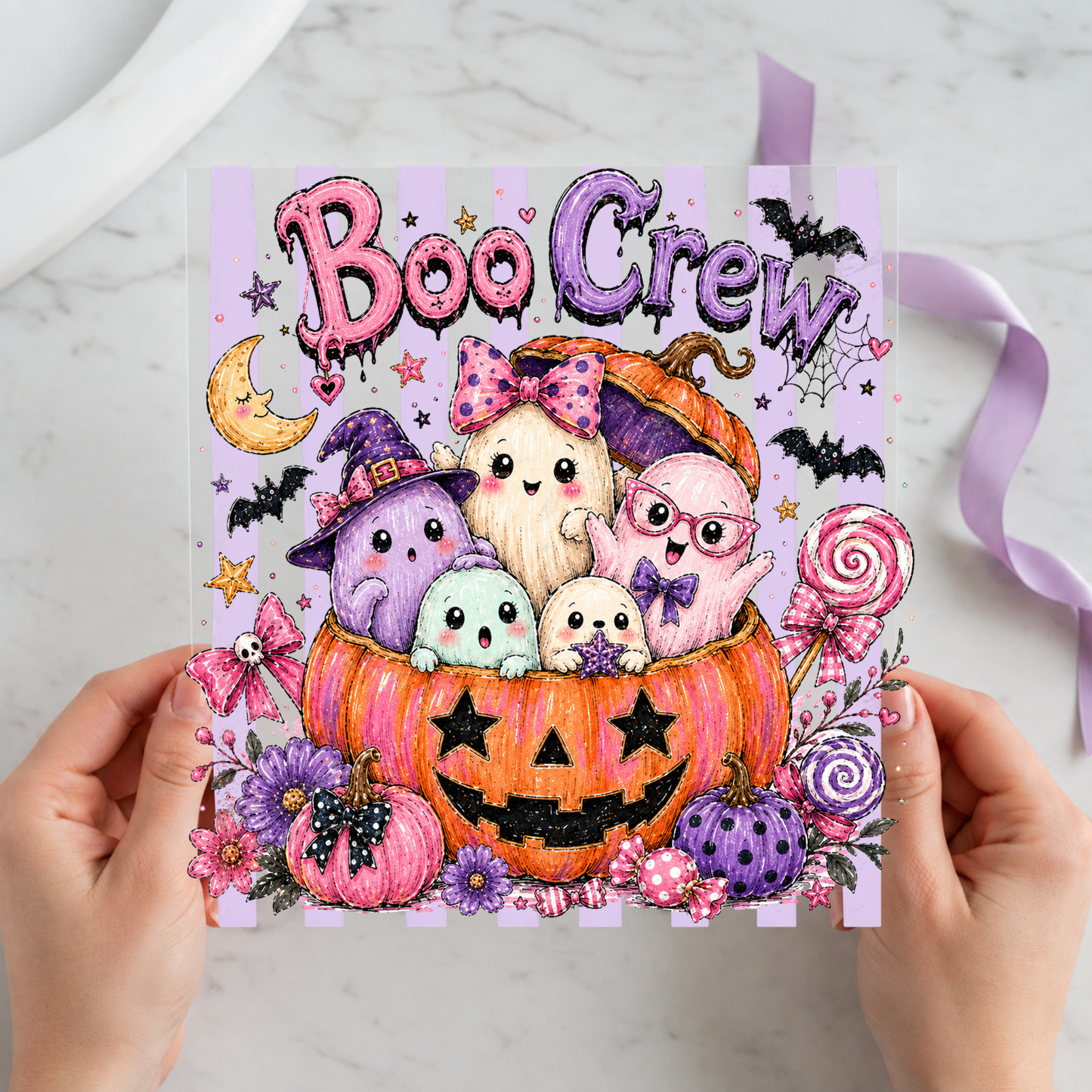 Boo Crew Pastel Pumpkin featuring pastel ghosts and skulls gathered inside a purple pumpkin on a 12x12 ready-to-press DTF heat transfer