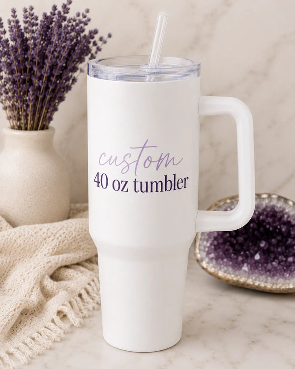 White custom 40 oz stainless steel tumbler with handle and straw lid, 'custom 40 oz tumbler' script and serif text, styled with lavender and amethyst crystal - Marie Gems