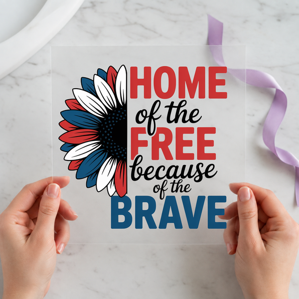 Home of the Free Because of the Brave sunflower DTF transfer held on clear film, red white and blue