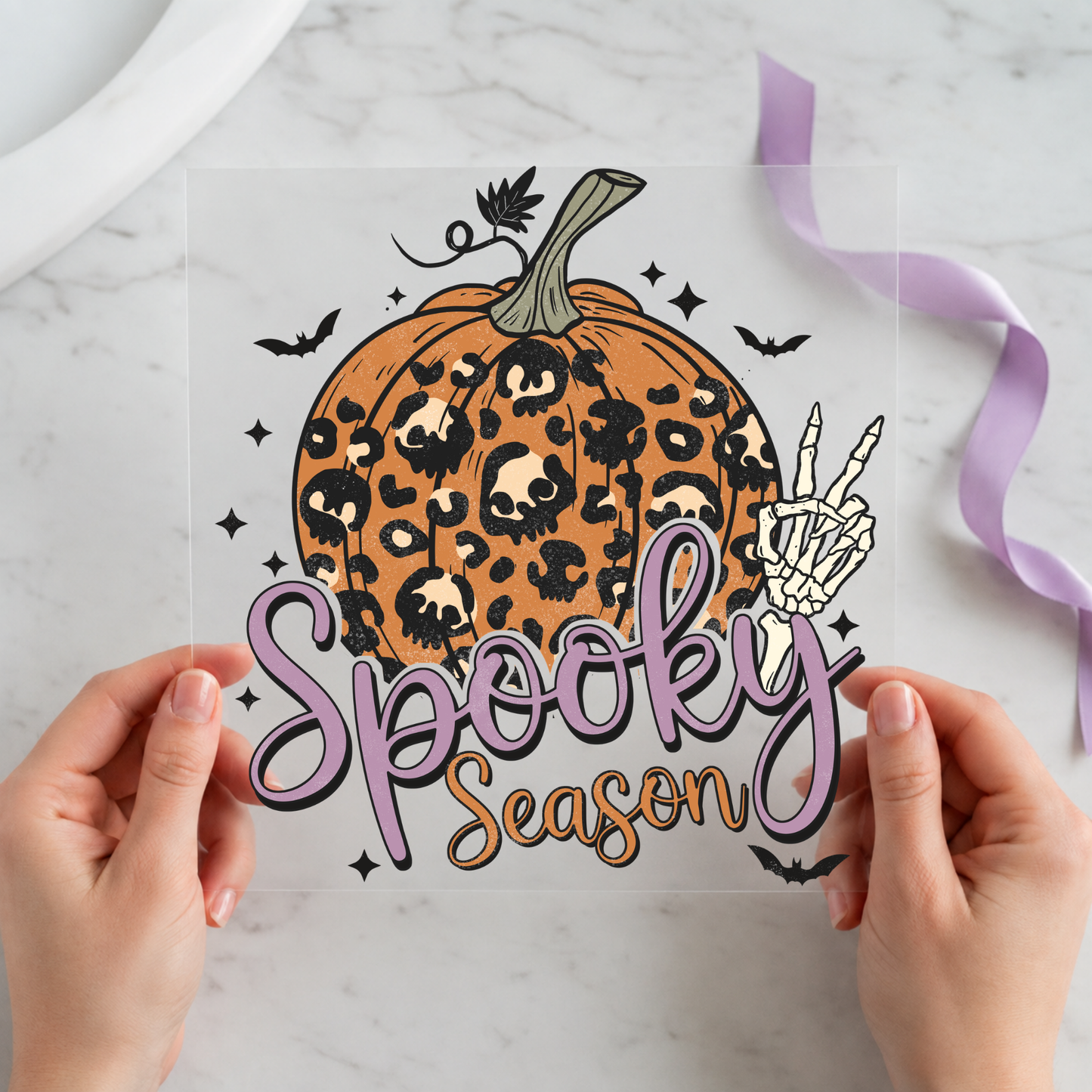 Leopard Pumpkin Spooky Season featuring leopard-print pumpkin with skeleton hand, bats and pink script on a 12x12 ready-to-press DTF heat transfer