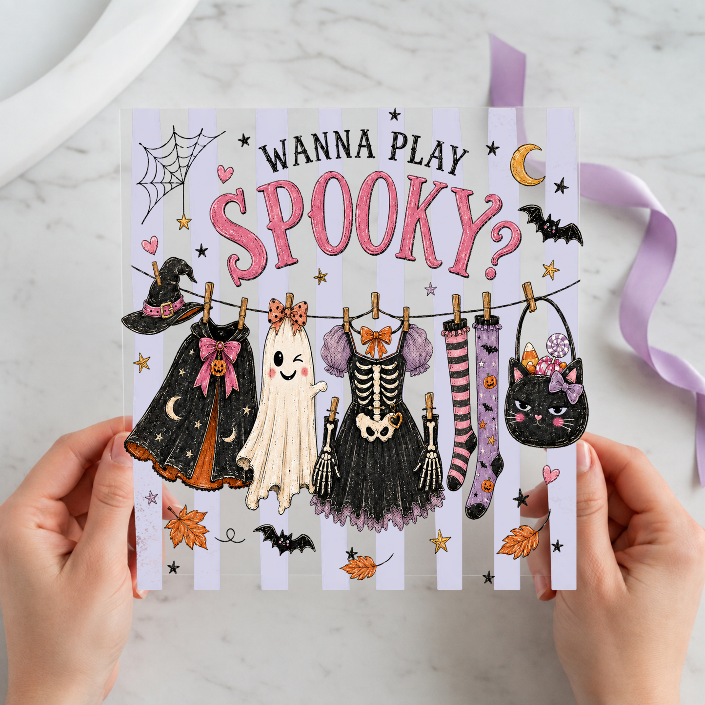 Wanna Play Spooky Halloween Clothesline featuring clothesline of witch, ghost, skeleton and striped Halloween garments on a 12x12 ready-to-press DTF heat transfer