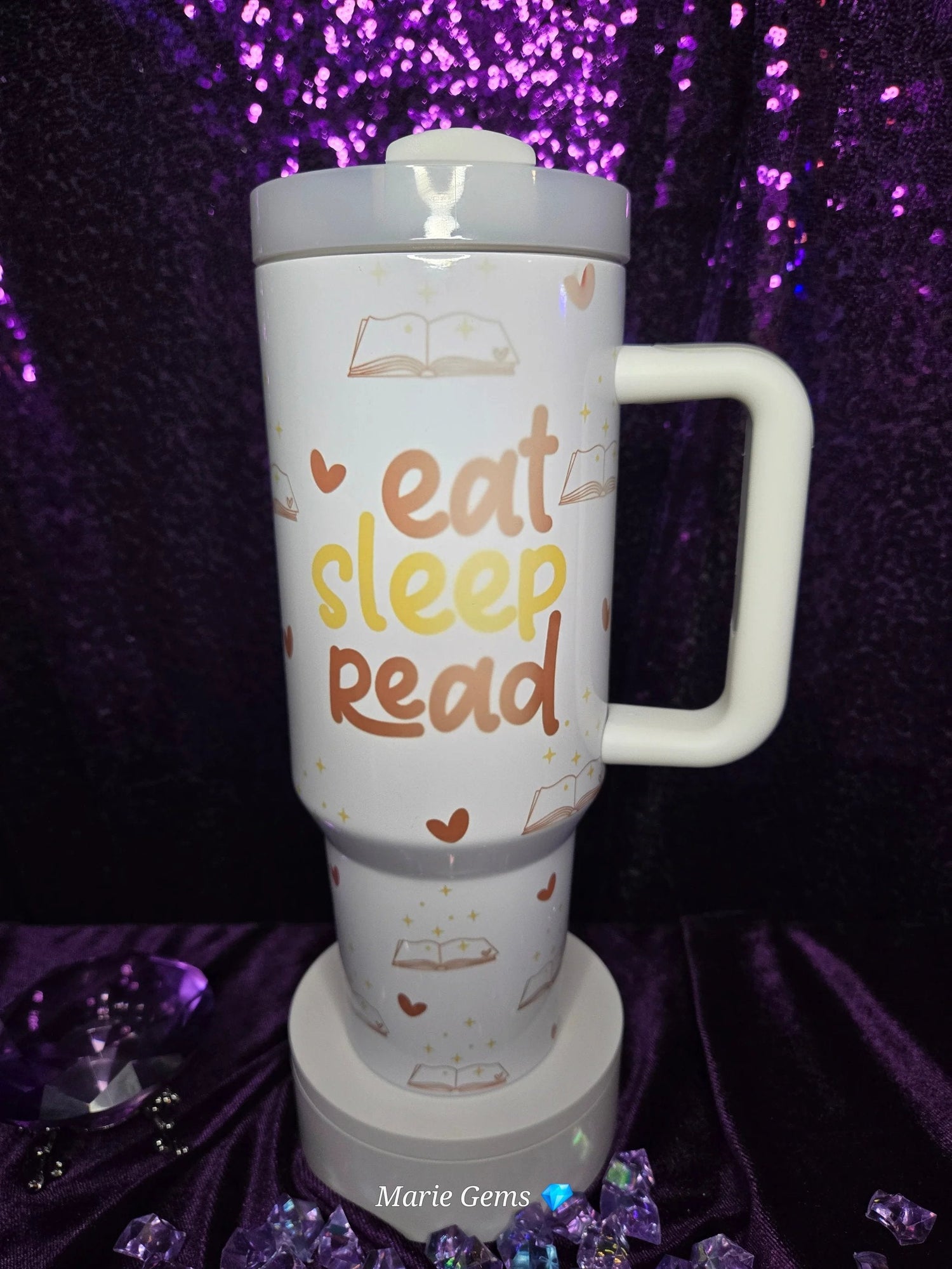 40oz Tumblers in assorted colors with white labels on a wooden table.