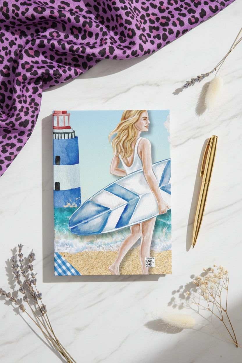 Coastal lighthouse and surfer notebook shown from the back