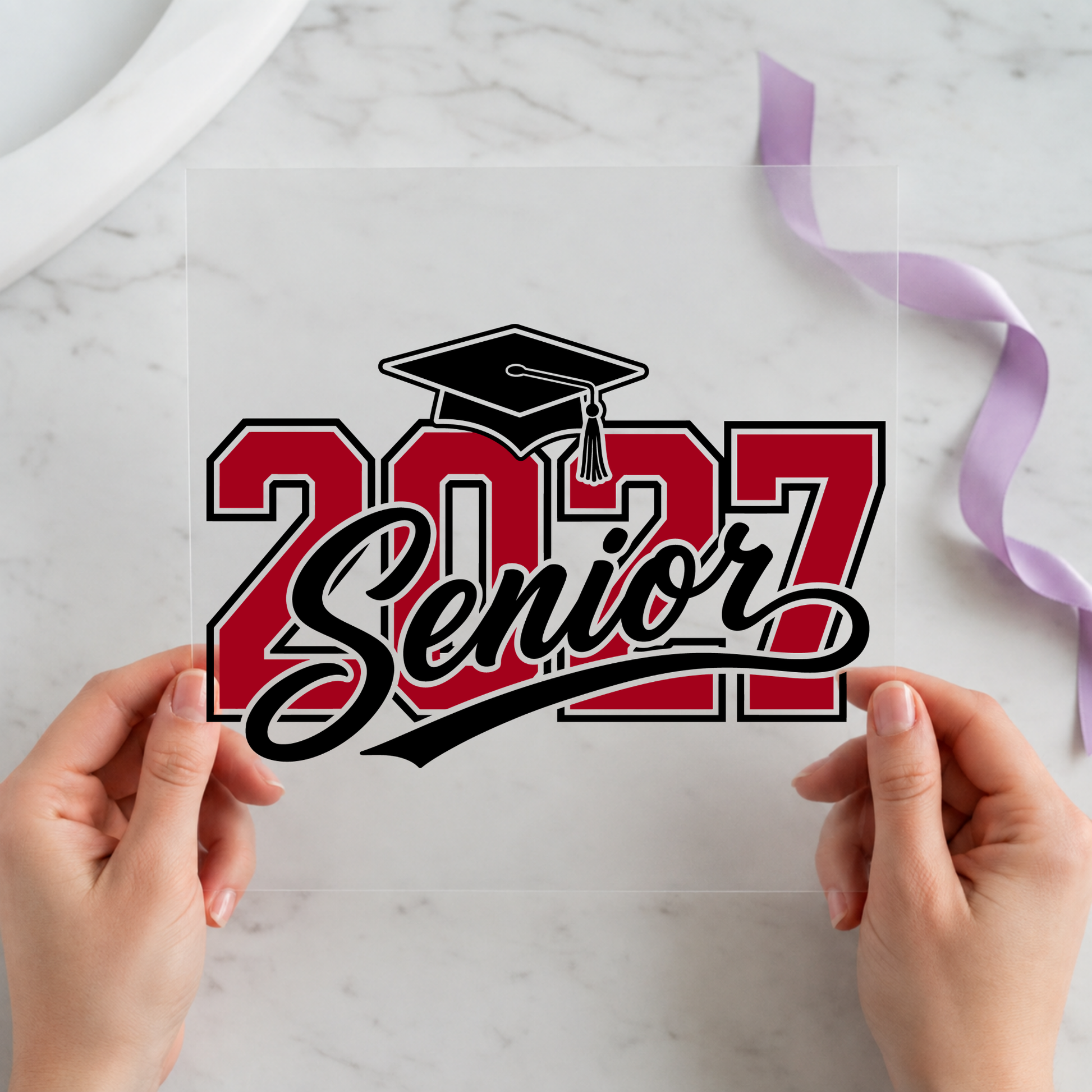 2027 Senior Graduation Cap Red Black featuring red and black 2027 lettering topped with a graduation cap on a 12x12 ready-to-press DTF heat transfer