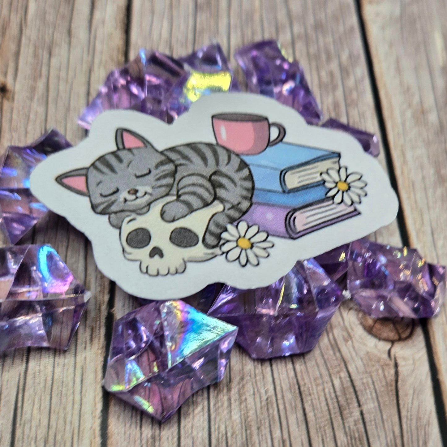 Cozy Goth Cat Sticker - Sleeping Feline on Skull with Books & Daisies - Whimsical Dark Academia Decal
