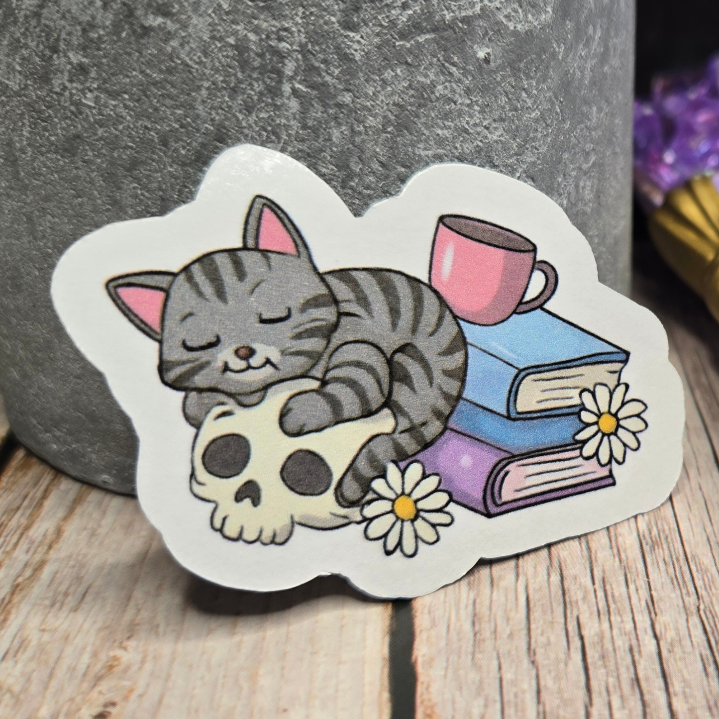 Cozy Goth Cat Sticker - Sleeping Feline on Skull with Books & Daisies - Whimsical Dark Academia Decal