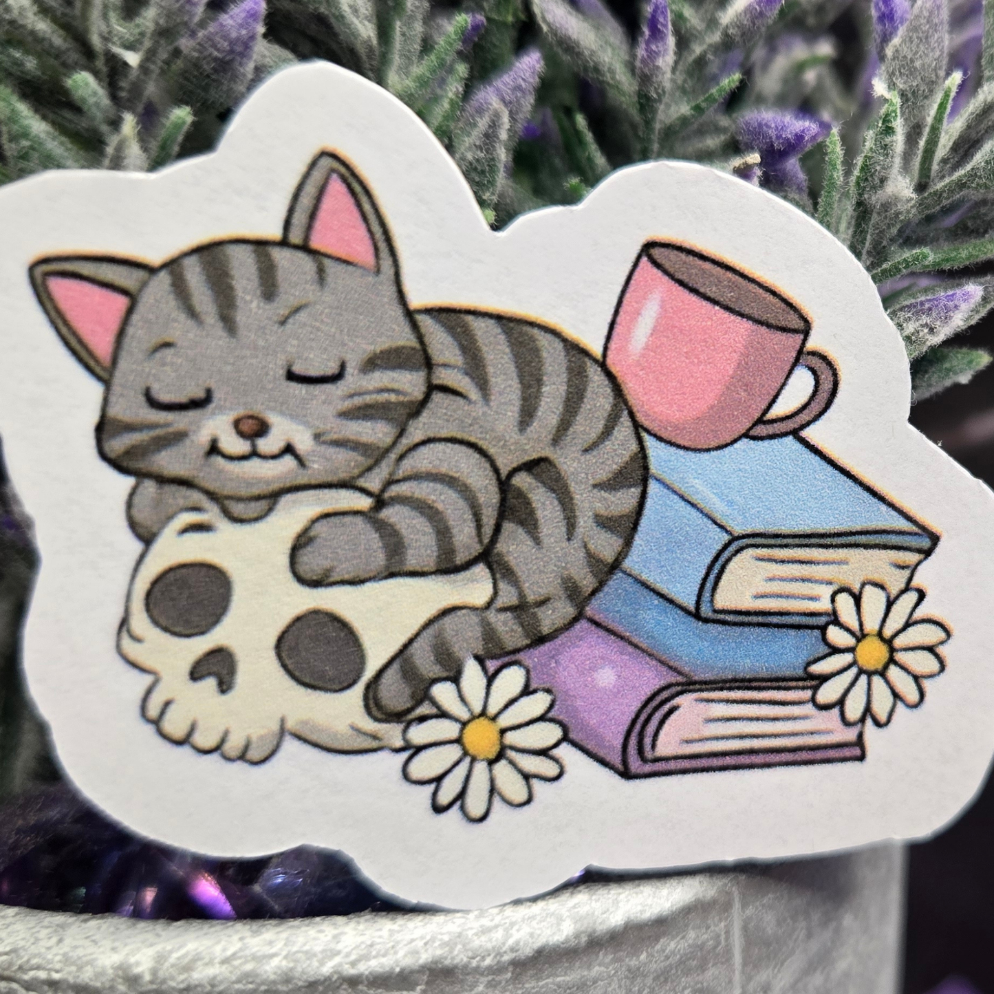 Cozy Goth Cat Sticker - Sleeping Feline on Skull with Books & Daisies - Whimsical Dark Academia Decal