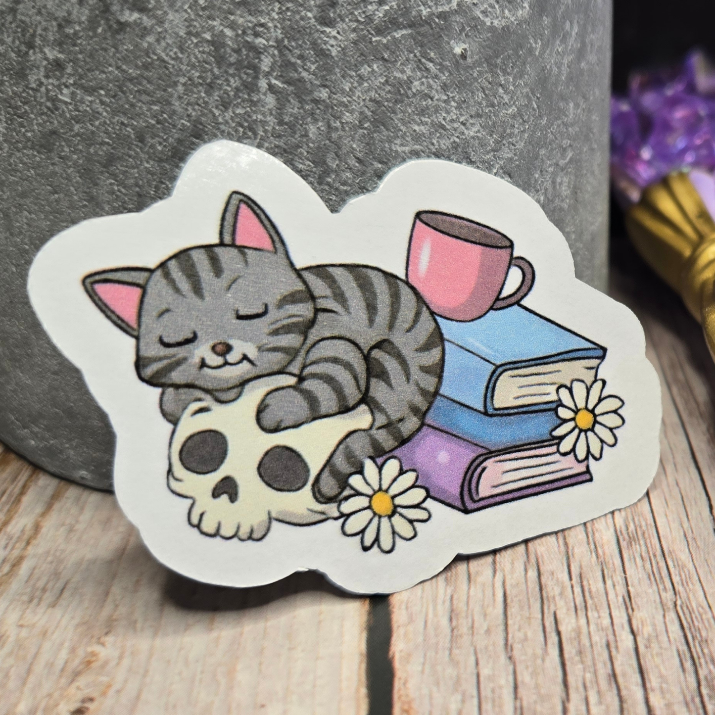 Cozy Goth Cat Sticker - Sleeping Feline on Skull with Books & Daisies - Whimsical Dark Academia Decal