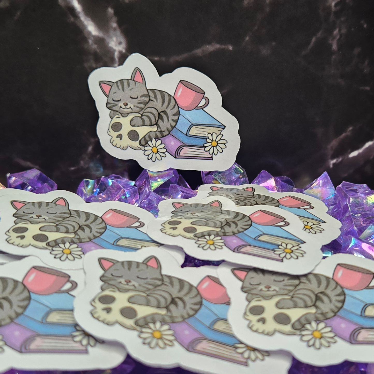 Cozy Goth Cat Sticker - Sleeping Feline on Skull with Books & Daisies - Whimsical Dark Academia Decal