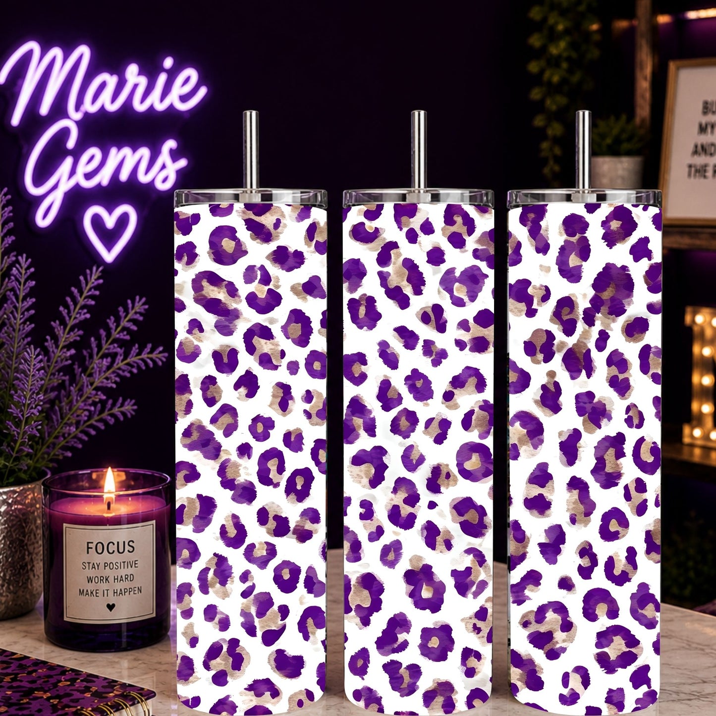 Three Purple Leopard Print 20oz Tumbler Amethyst Cheetah Stainless Steel Cups on a desk with decorative candle and neon sign