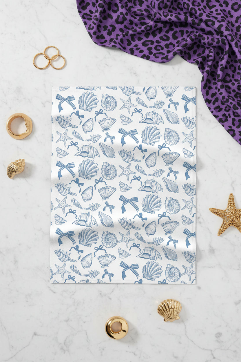 Close-up of cozy fleece baby blanket featuring a nautical sea shell pattern