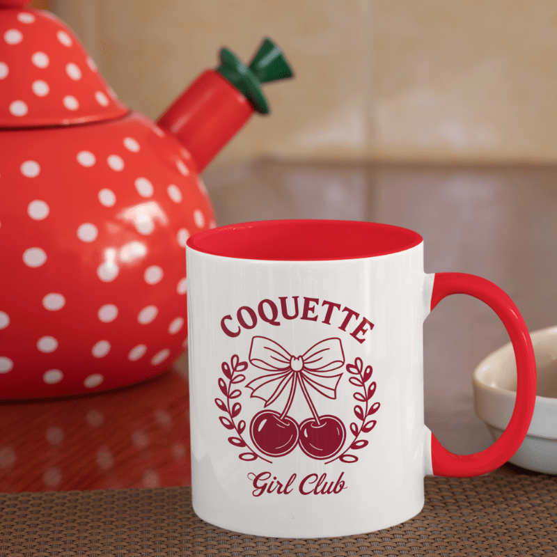 Aesthetic Cherry Coquette Coffee Mug with cherry bow design and red handle on kitchen table setting