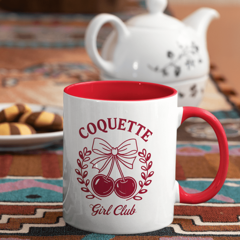 Aesthetic Cherry Coquette Coffee Mug with cherry bow design, red interior, and Coquette Girl Club text on white ceramic.