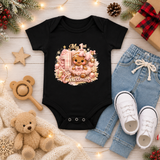 Baby Girl First Christmas Bodysuit Infant Bodysuit Outfit showing an adorable gingerbread girl surrounded by pink ornaments, gifts, festive accents, and "My 1st Christmas" artwork