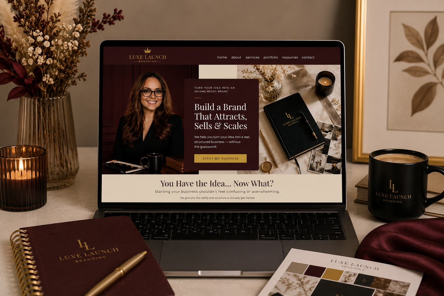 Luxe Launch website displayed on a laptop with a coffee cup and notebook in the foreground.