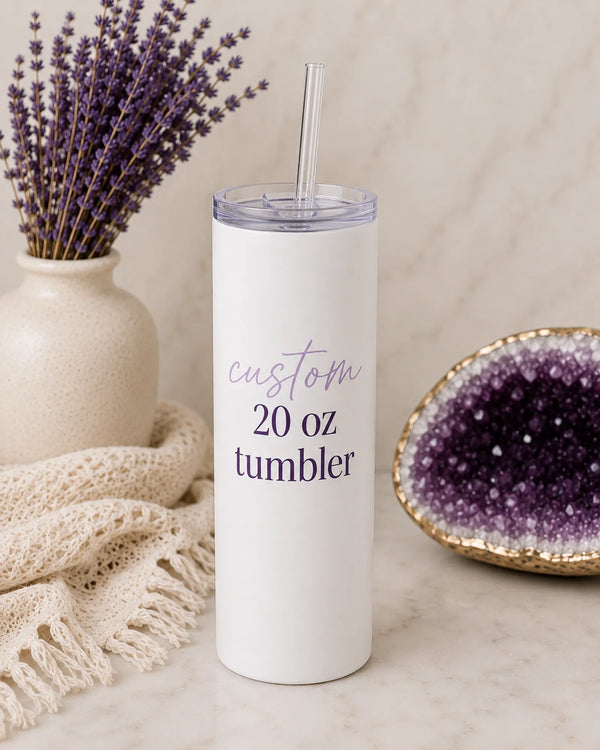 White custom 20 oz stainless steel tumbler with straw lid and 'custom 20 oz tumbler' script and serif text, styled with lavender and amethyst crystal - Marie Gems