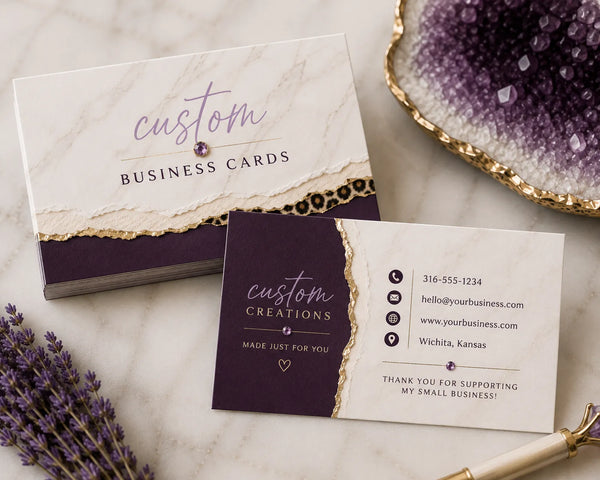 Custom marble and purple business cards with 'custom business cards' and contact info layout, styled with amethyst crystals and leopard print accents - Marie Gems