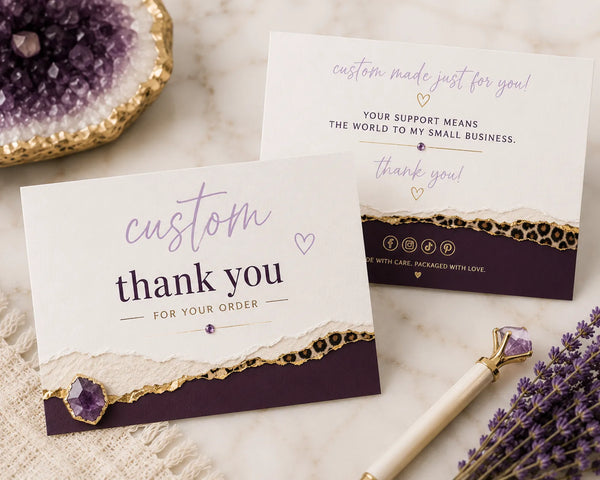 Custom purple and gold thank you cards with 'custom thank you for your order' script text, styled with amethyst crystals and leopard print accents - Marie Gems