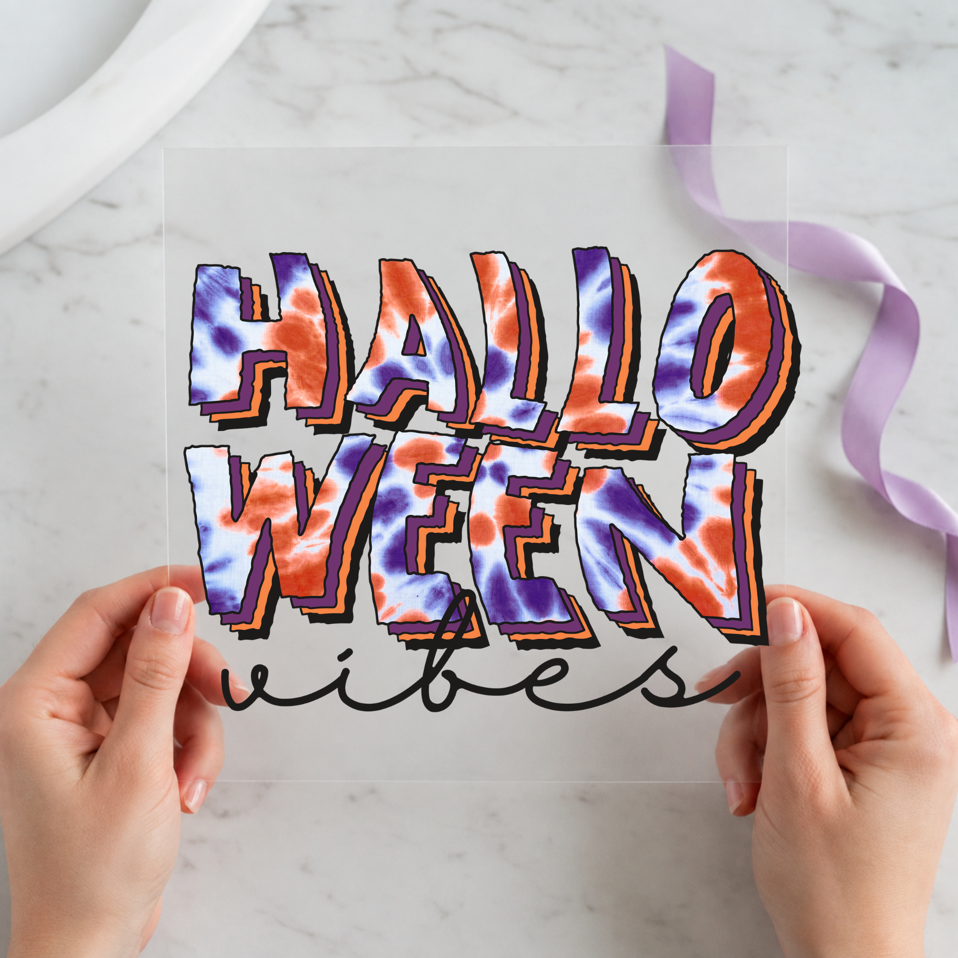 Halloween Vibes Colorful featuring large glossy Halloween Vibes lettering in purple, orange and blue on a 12x12 ready-to-press DTF heat transfer