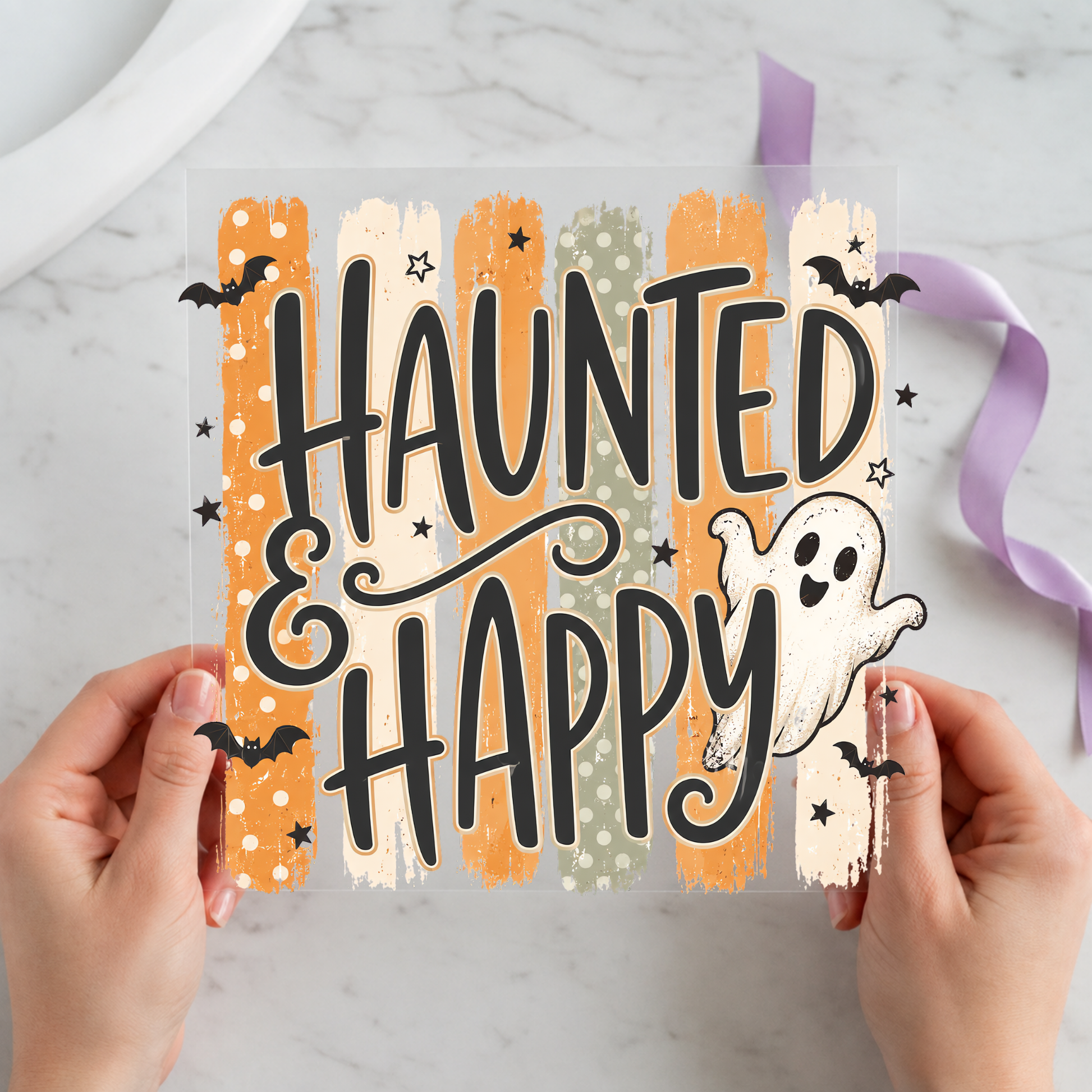 Haunted and Happy Ghosts featuring large Haunted and Happy lettering with two friendly ghosts on a 12x12 ready-to-press DTF heat transfer