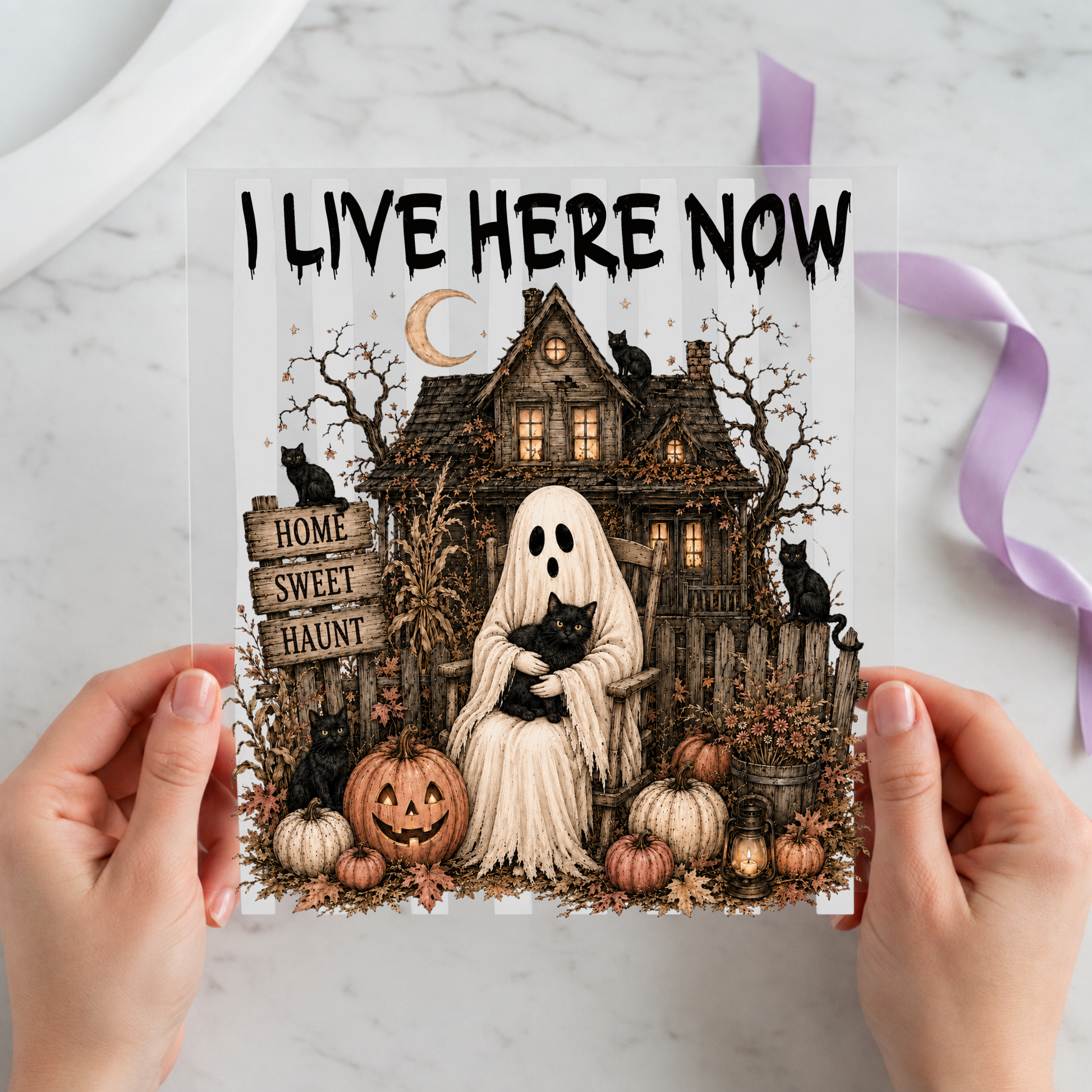 I Live Here Now Haunted House Ghost featuring white ghost seated before a detailed haunted house and pumpkins on a 12x12 ready-to-press DTF heat transfer