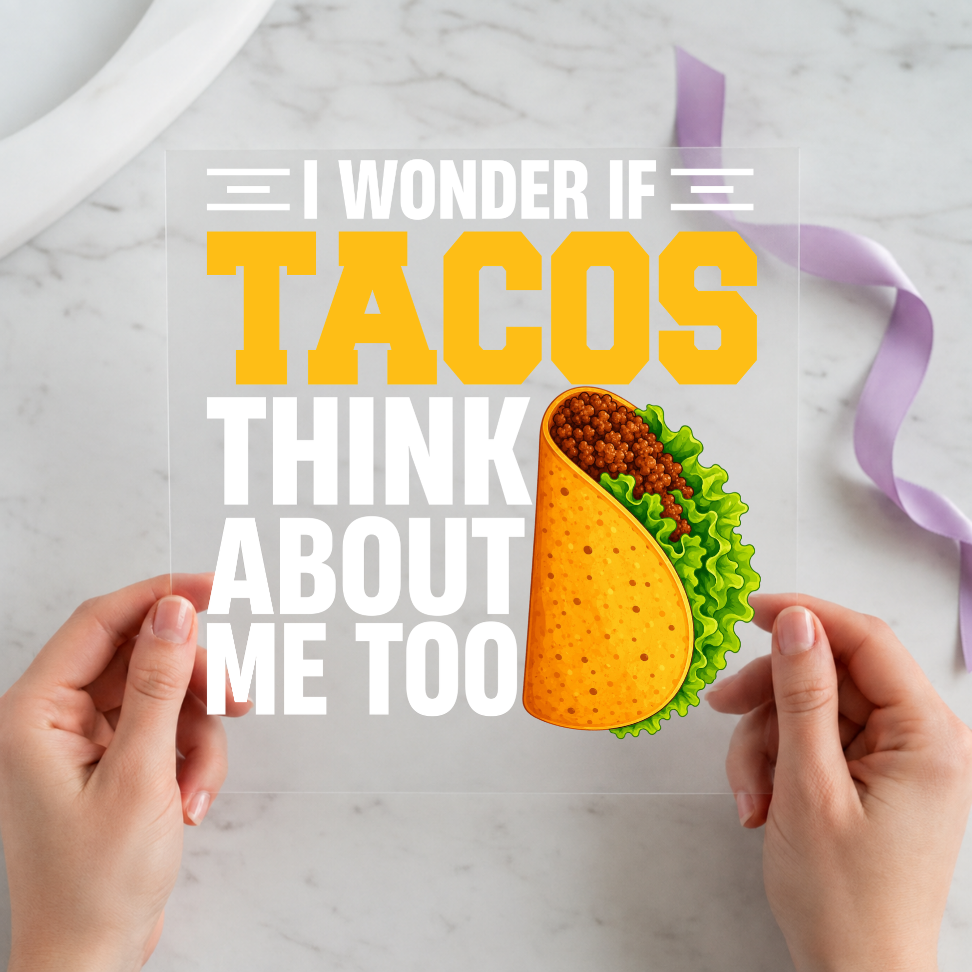 I Wonder If Tacos Think About Me Too featuring bright taco beside stacked yellow and white lettering on a 12x12 ready-to-press DTF heat transfer