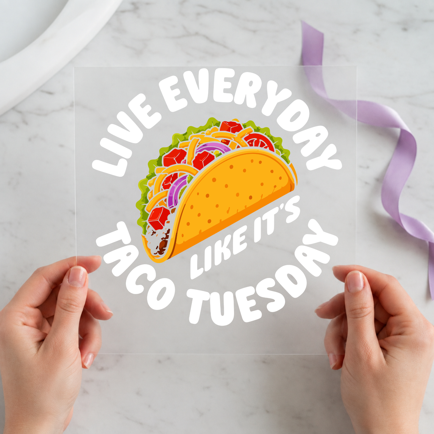 Live Every Day Like It's Taco Tuesday featuring bright taco surrounded by curved white motivational lettering on a 12x12 ready-to-press DTF heat transfer