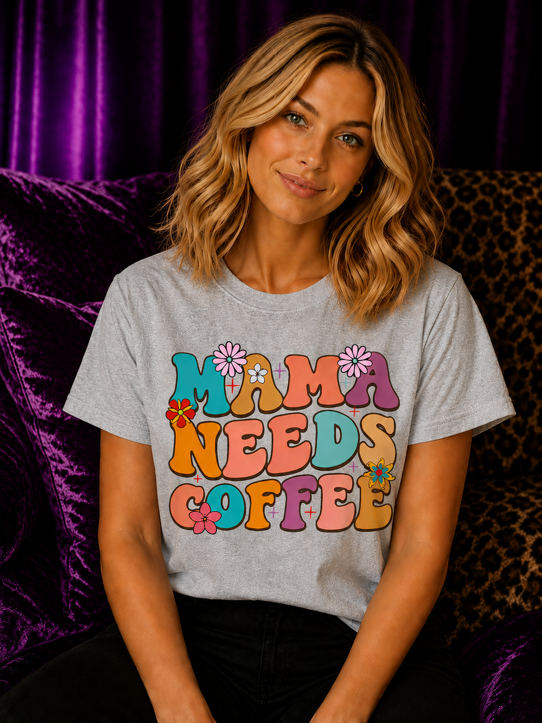 Blonde woman wearing a sports grey Gildan Mama Needs Coffee T-Shirt with colorful retro mom coffee graphic