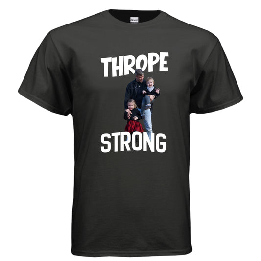 Black t-shirt with a graphic of a family and the text 'Thrope Strong' on a white background