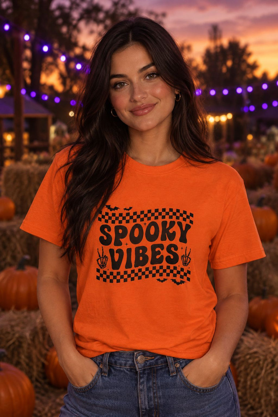 Person wearing the Spooky Vibes Retro Checkerboard t-shirt in orange with checkerboard Spooky Vibes graphic in a fall setting