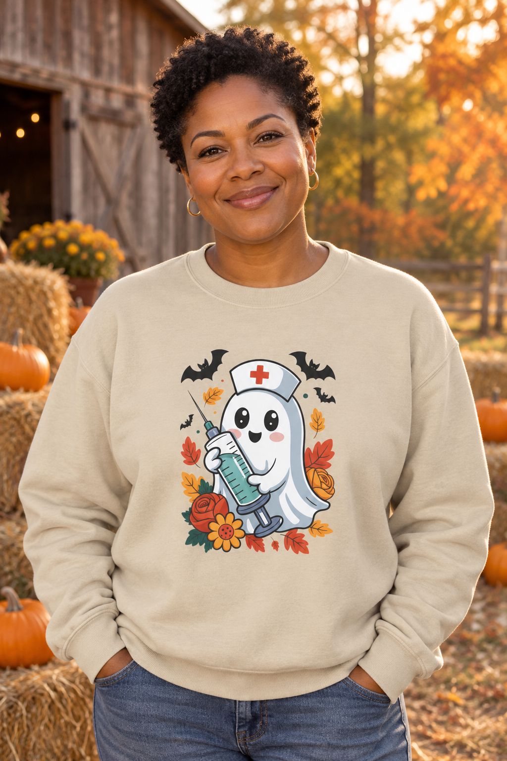 Person wearing the Nurse Ghost Halloween crewneck sweatshirt in sand with cute nurse ghost graphic in a fall setting