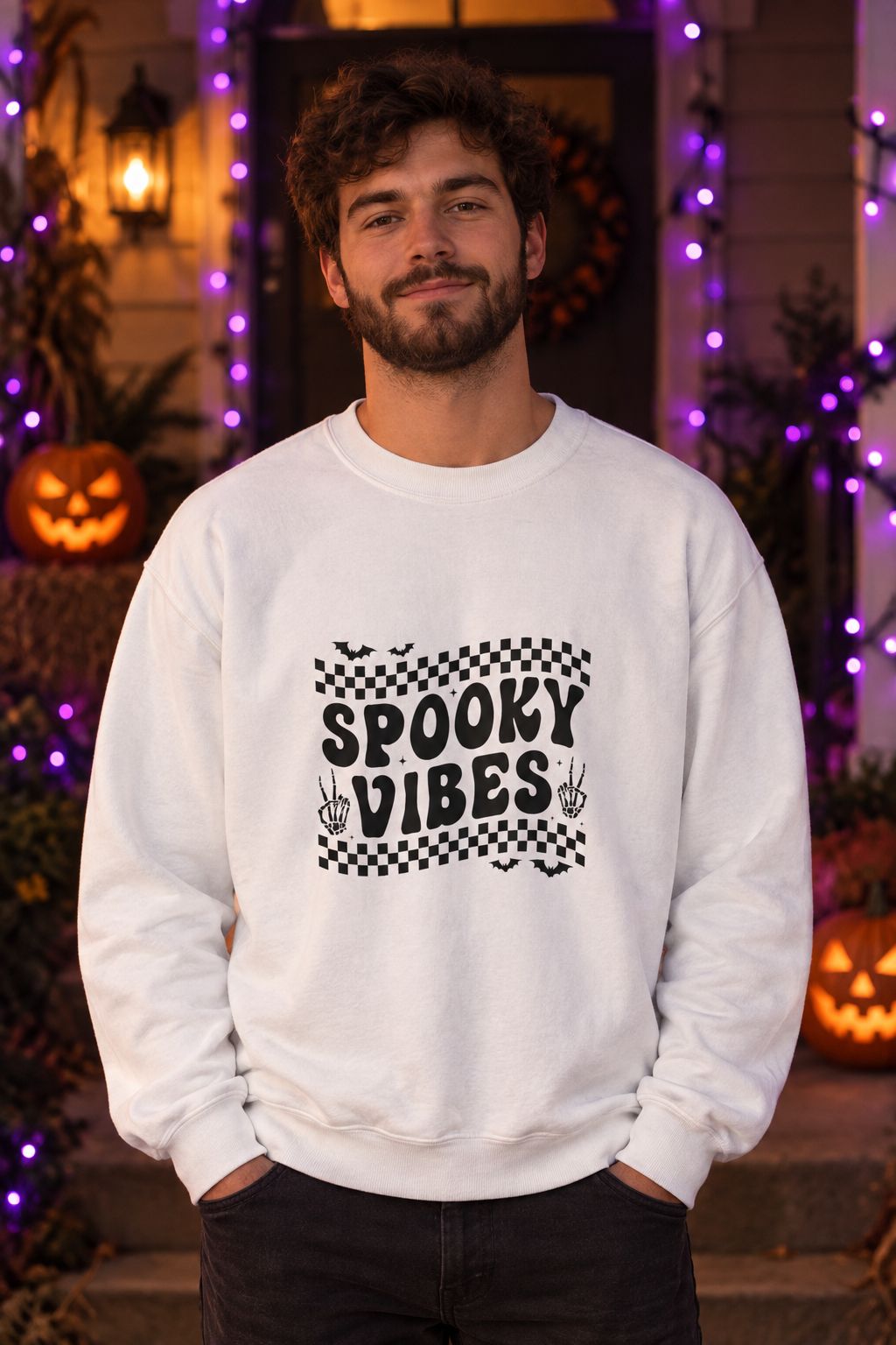 Person wearing the Spooky Vibes Retro Checkerboard crewneck sweatshirt in white with checkerboard Spooky Vibes graphic in a fall setting
