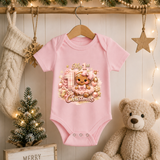 Baby Girl First Christmas Bodysuit Infant Bodysuit Outfit showing an adorable gingerbread girl surrounded by pink ornaments, gifts, festive accents, and "My 1st Christmas" artwork