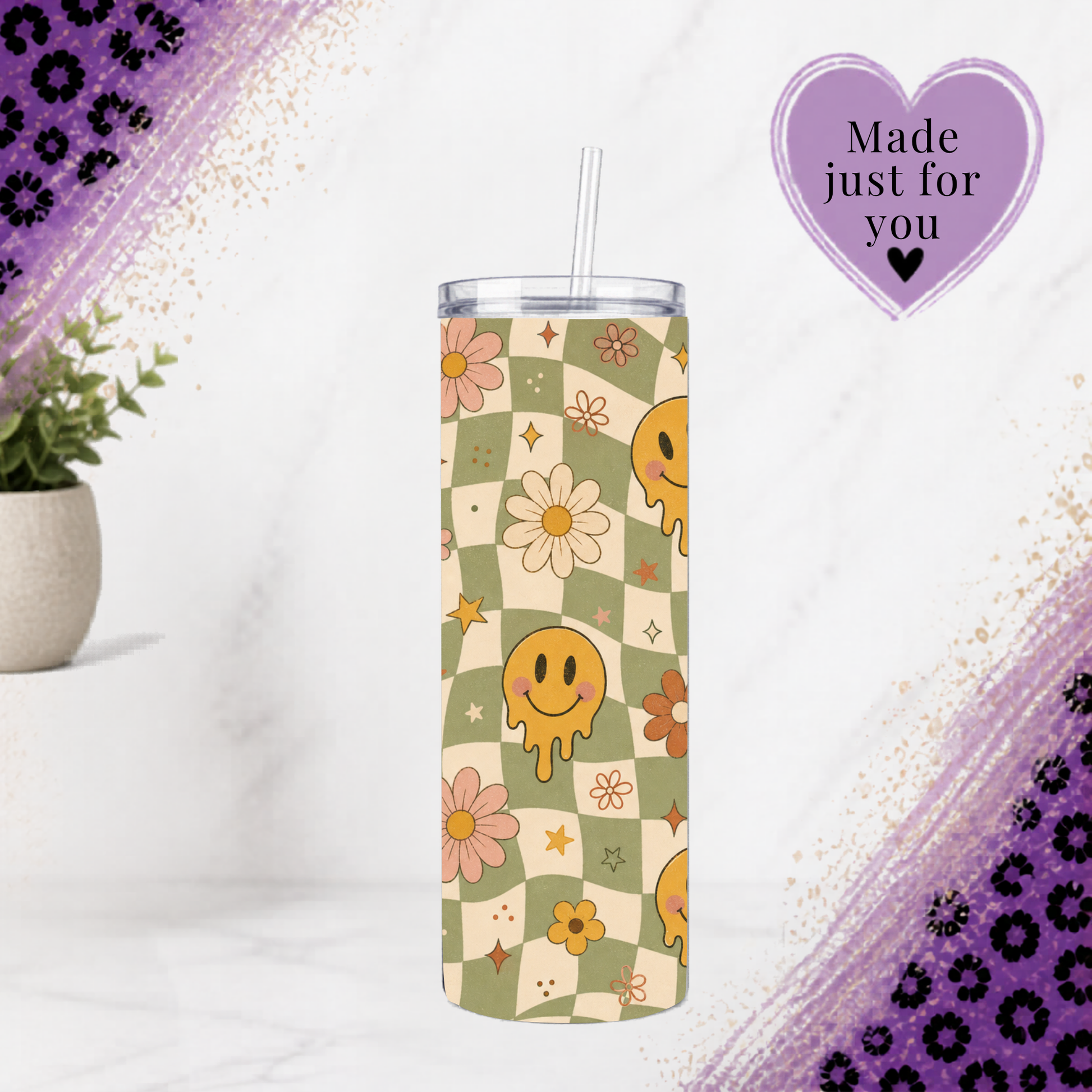 A tall insulated tumbler with a clear lid and straw, featuring a retro checkered pattern with smiley faces, flowers, and stars in muted green, cream, pink, and yellow. The tumbler is centered on a white marble surface with decorative purple glitter corner accents and a purple 'Made just for you' badge in the upper right.