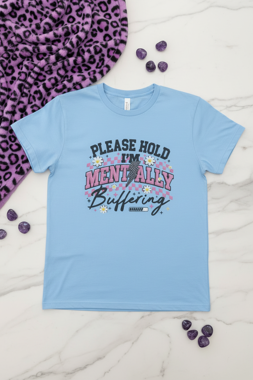 Please Hold I'm Mentally Buffering shirt shown in a casual lifestyle setting