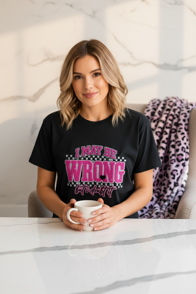 I May Be Wrong But I Doubt It T-Shirt | Funny Confident Graphic Tee with bold pink lettering on black fabric