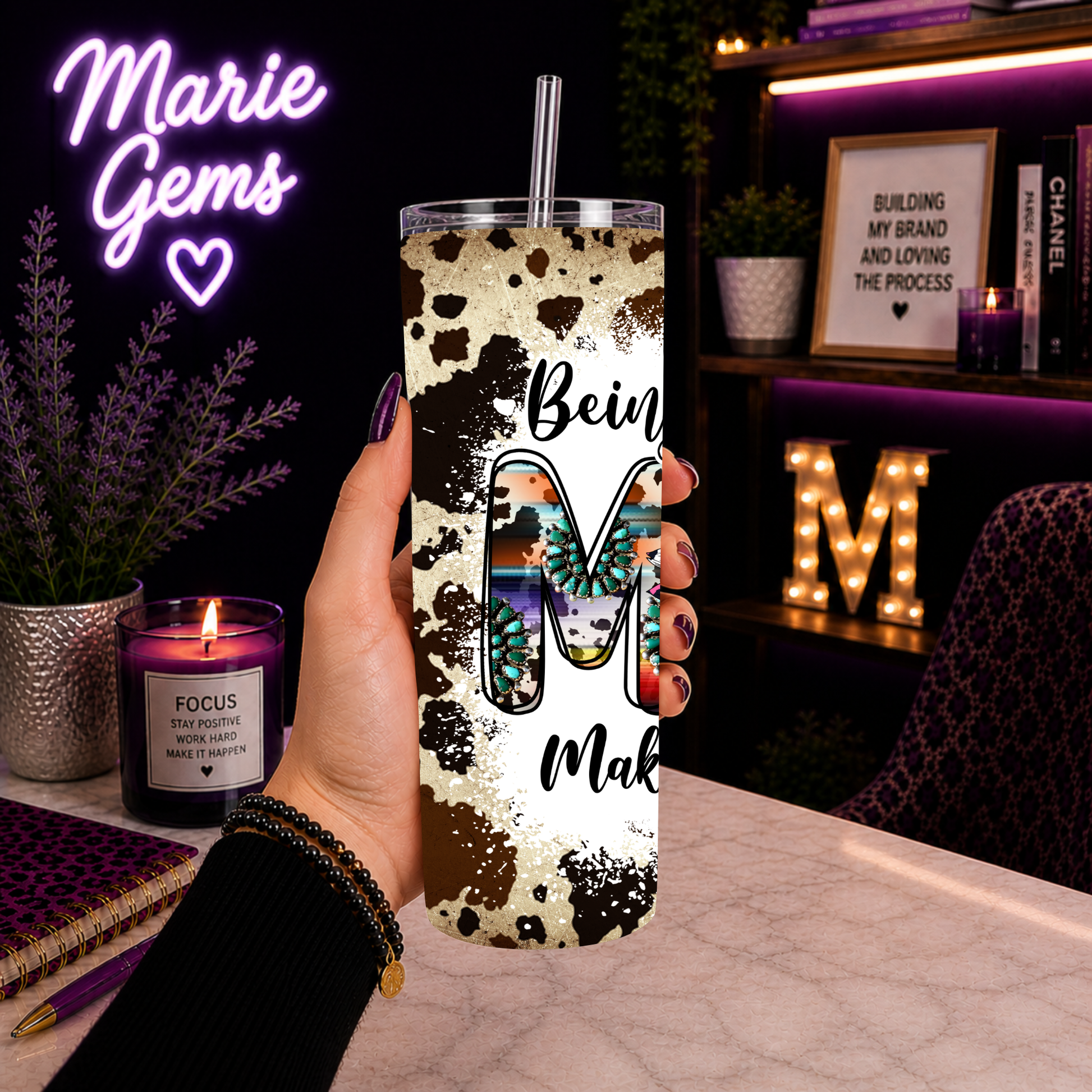 Hand holding Western Mom 20oz Tumbler Cowhide Sunflower Travel Mug Boho Country Gift For Her Being A Mom Makes My Life Complete in cozy desk setting