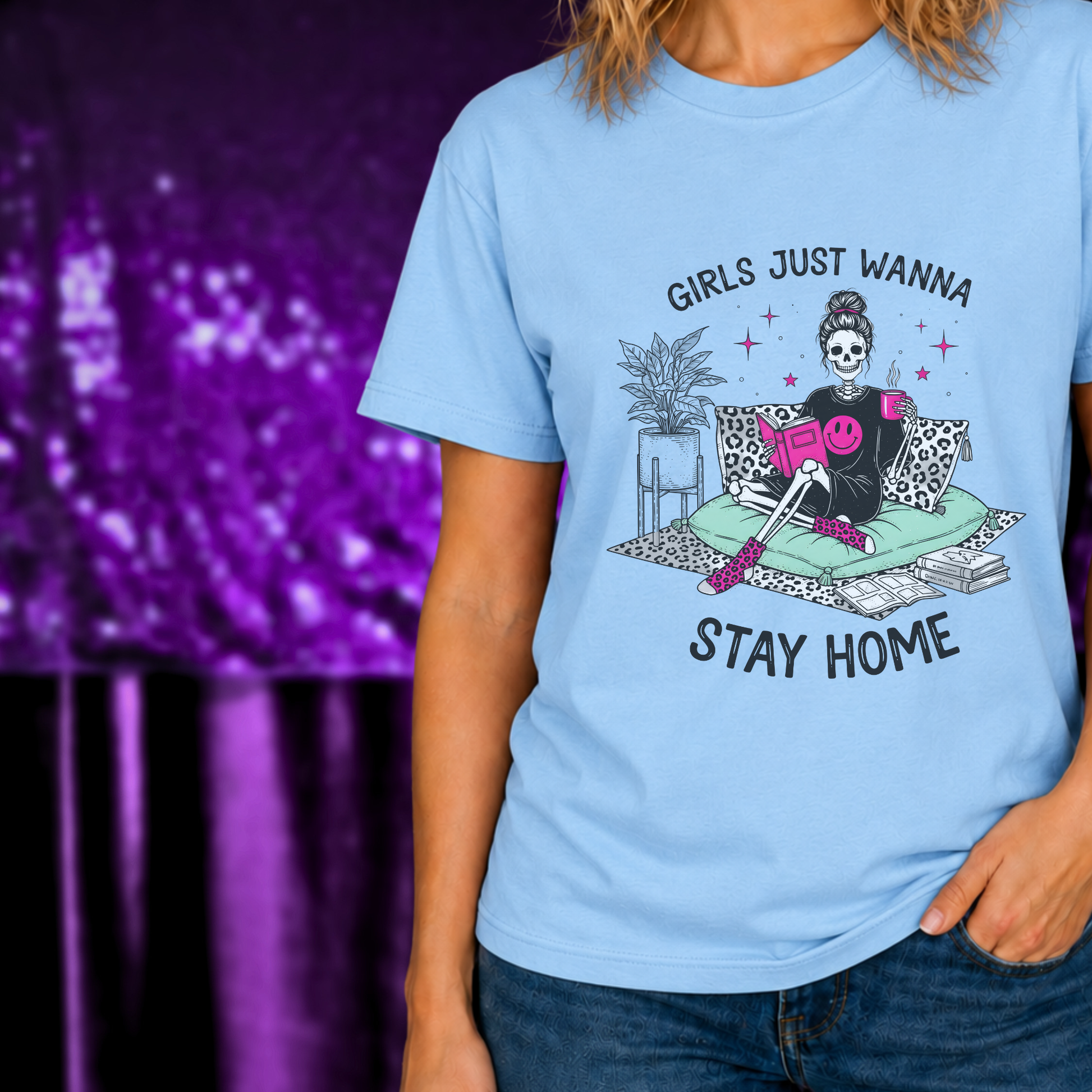 Girls Just Wanna Stay Home T-Shirt | Cozy Introvert Tee | Comfort First Shirt with skeleton reading and coffee on blue fabric
