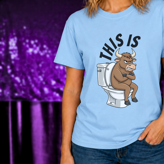 This Is Bull T-Shirt | Funny Sarcastic Graphic Tee | Humor Statement Shirt with grumpy bull sitting on toilet on light blue fabric