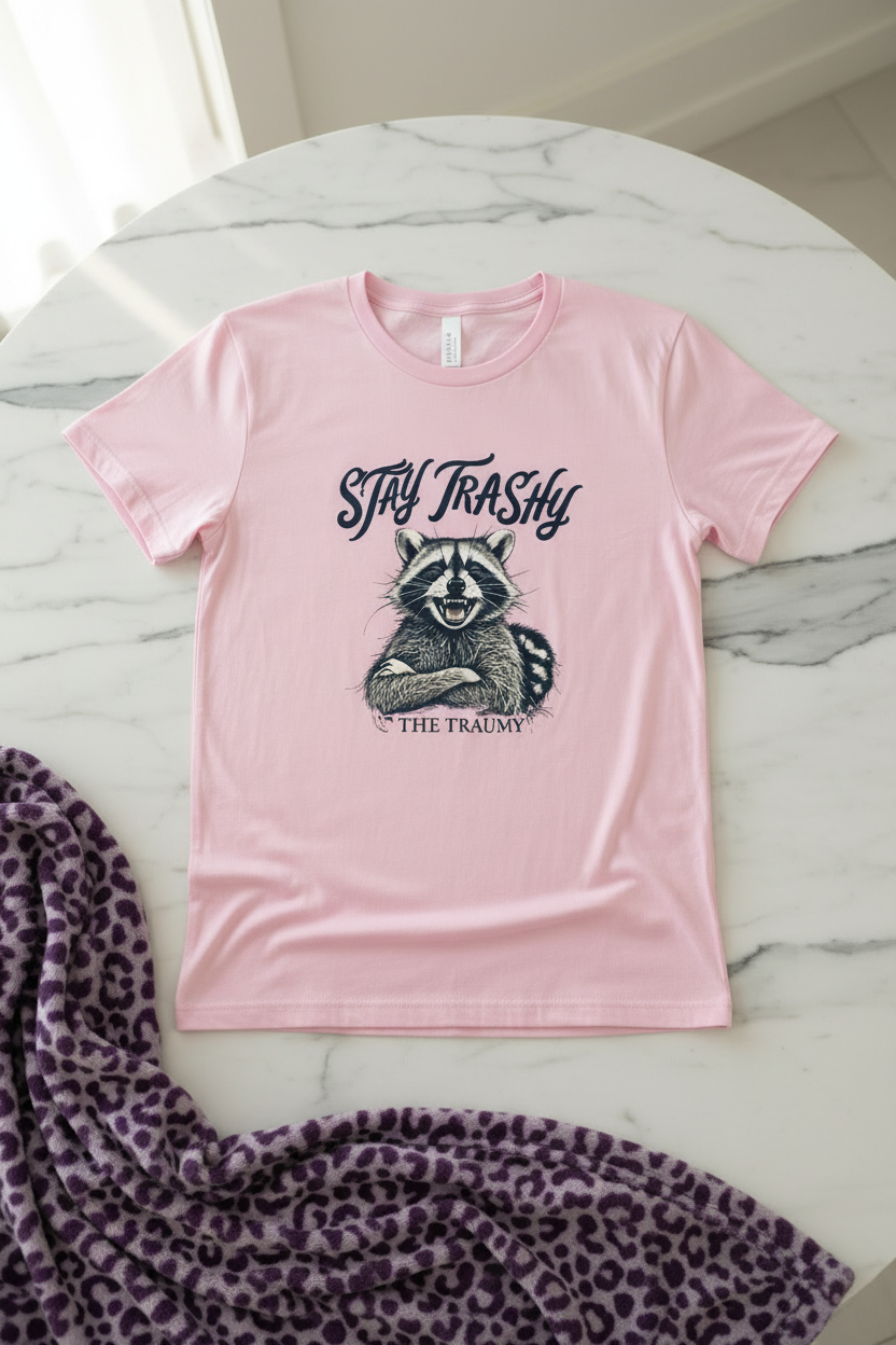 Stay Trashy Raccoon T-Shirt shown in a styled product mockup