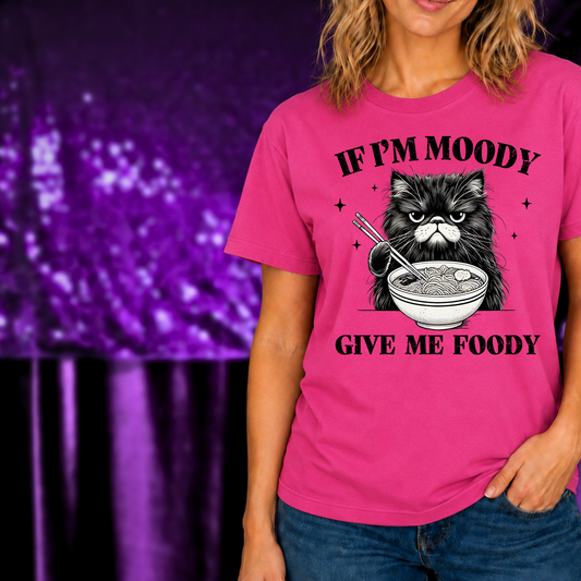 If I’m Moody Give Me Foody T-Shirt with grumpy cat holding chopsticks over ramen bowl on bright pink tee