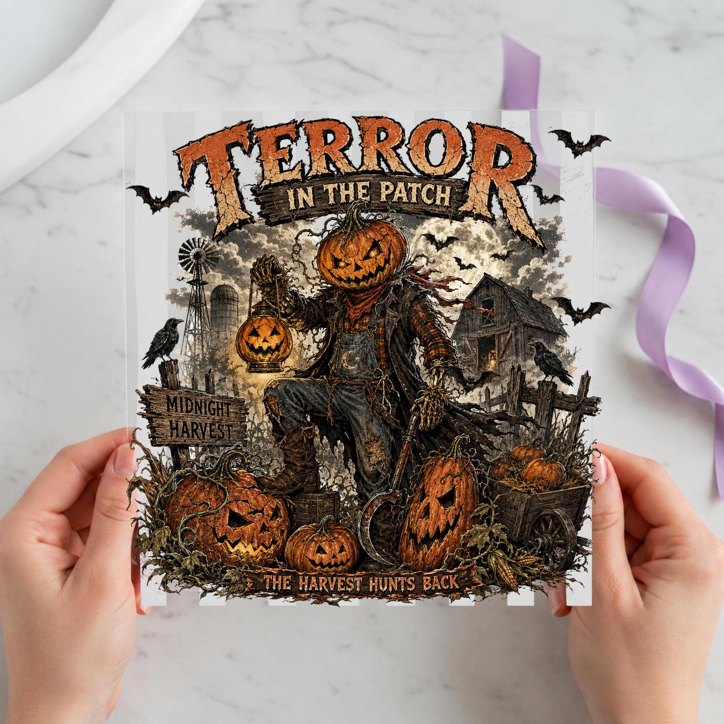 Terror in the Patch Scarecrow featuring menacing scarecrow among jack-o-lanterns, crows and a haunted farmhouse on a 12x12 ready-to-press DTF heat transfer