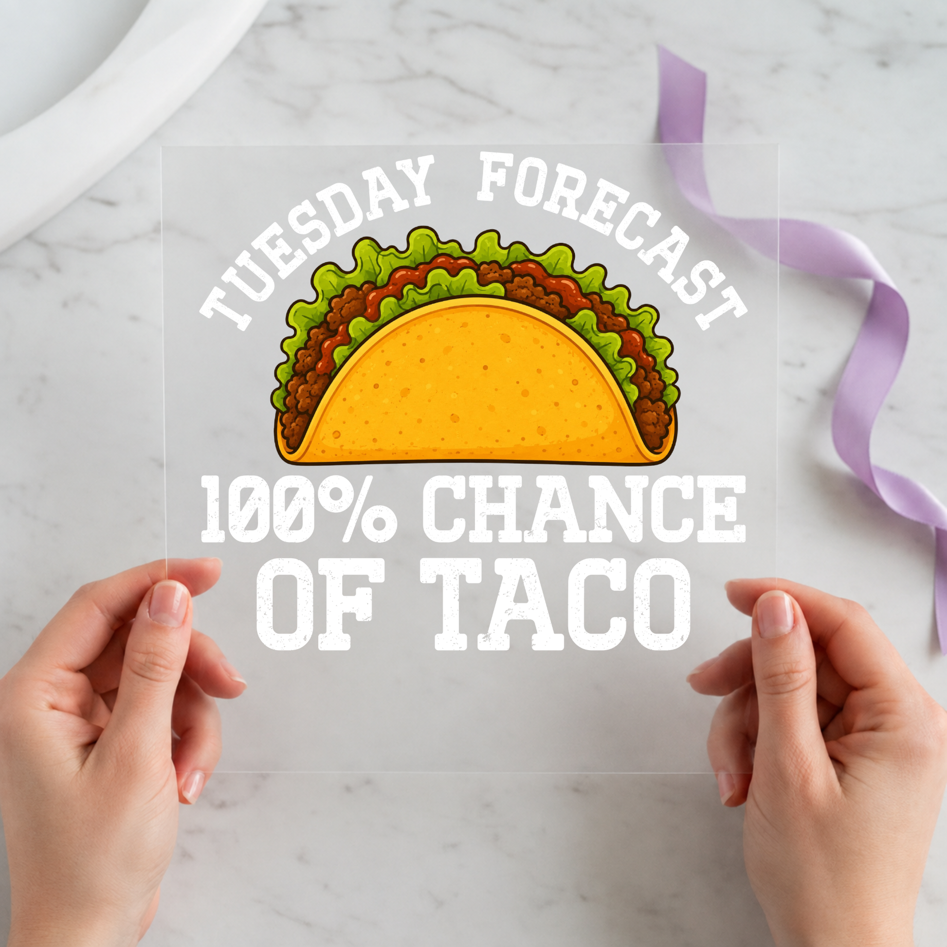 Tuesday Forecast 100% Chance of Taco featuring large taco beneath weather-forecast style white lettering on a 12x12 ready-to-press DTF heat transfer