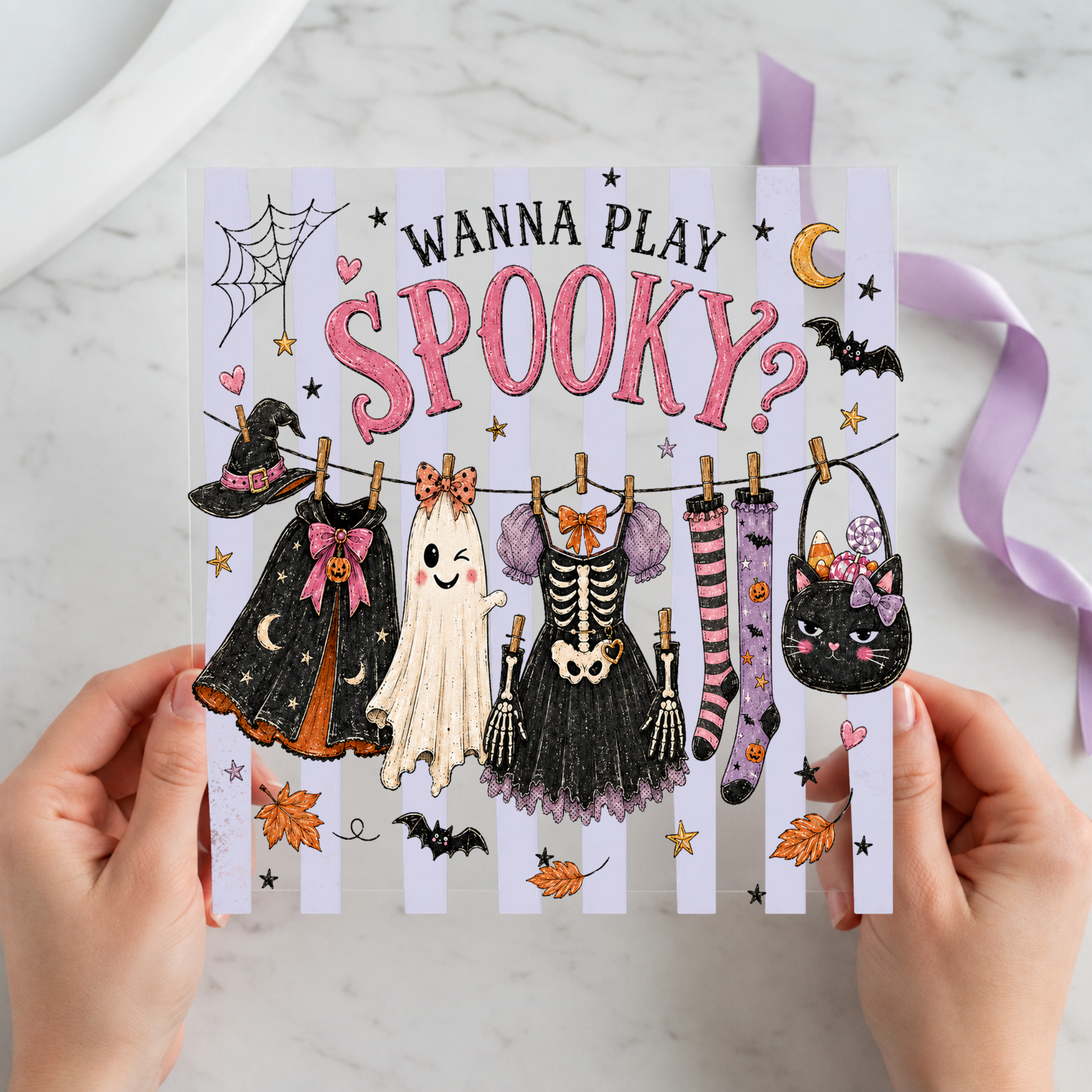 Wanna Play Spooky Halloween Clothesline featuring clothesline of witch, ghost, skeleton and striped Halloween garments on a 12x12 ready-to-press DTF heat transfer